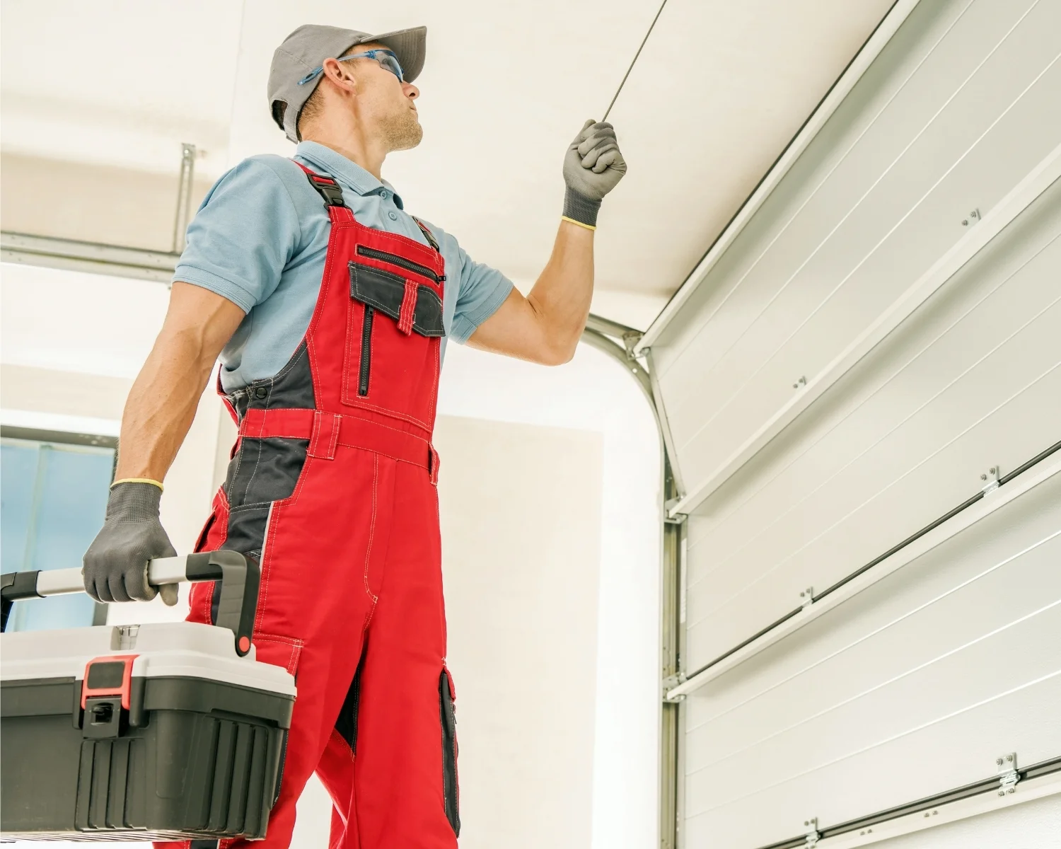North Carolina Garage Door Repair technician repairing a garage door