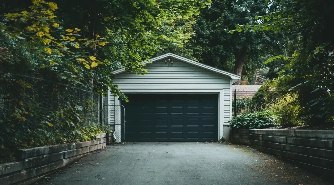 Garage door repair technician working on a North Carolina home
